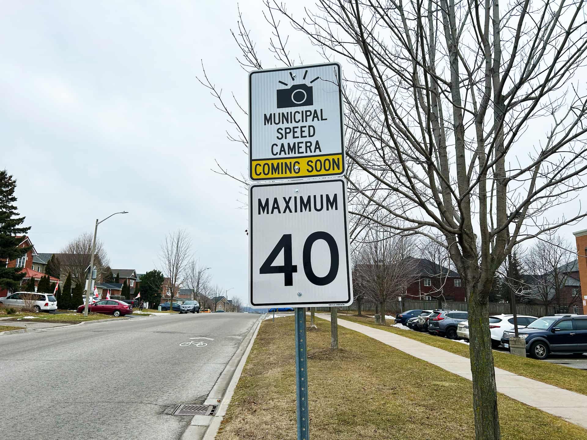 Road sign indicating a council speed camera coming soon and a maximum speed limit of 40 km/h on a residential road.